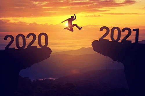 Person jumping from one cliff to another blog 2020 2021