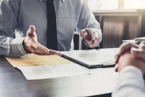 person receiving a check payment in an office